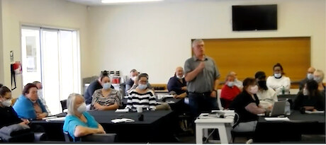 Terry Nicholas introducing staff at the hui.