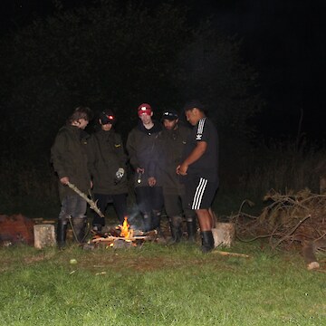 All the boys enjoying each others company around a fire that they have made. (left to right) Josiah Kawana, Sentre Harden, Josh Aitken, Raniera Smyth and Kaloni Taylor.