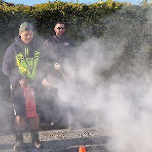 Kaloni Taylor using the CO2 extinguisher under the supervision of Daniel Munro.