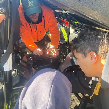 Josiah Kawana (in orange jacket) and Kaloni Talyor learning the different parts of an LUV.