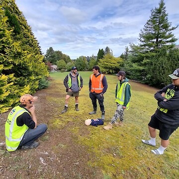 Danny Freestone running through CPR required scenario with (left to right) Michelangelo Tajani, Brian Kerr, Josh Aitken and Manaia Olsen.